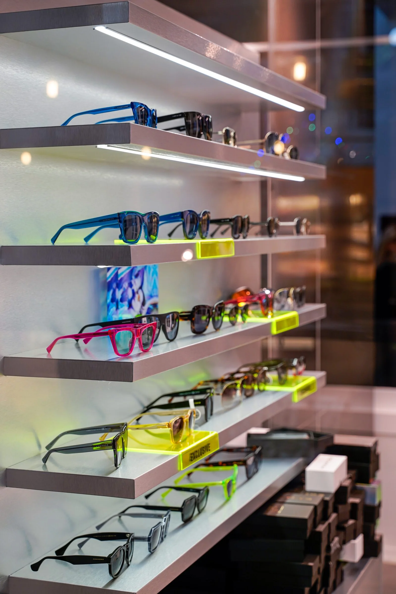 Display shelf with multiple pairs of sunglasses