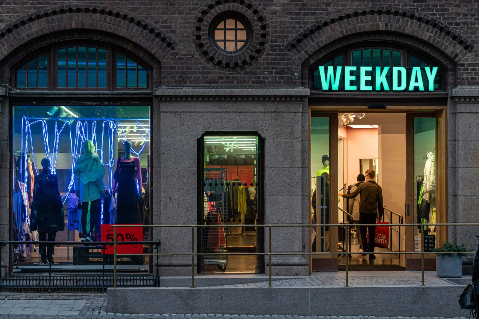 Exterior of a Weekday clothing store with mannequins in the window