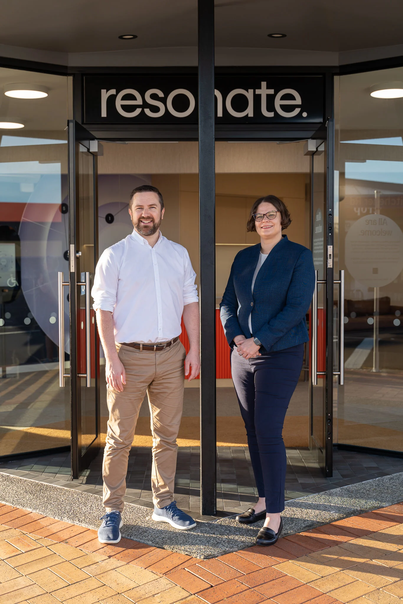 Man and woman in front of Resonate entrance