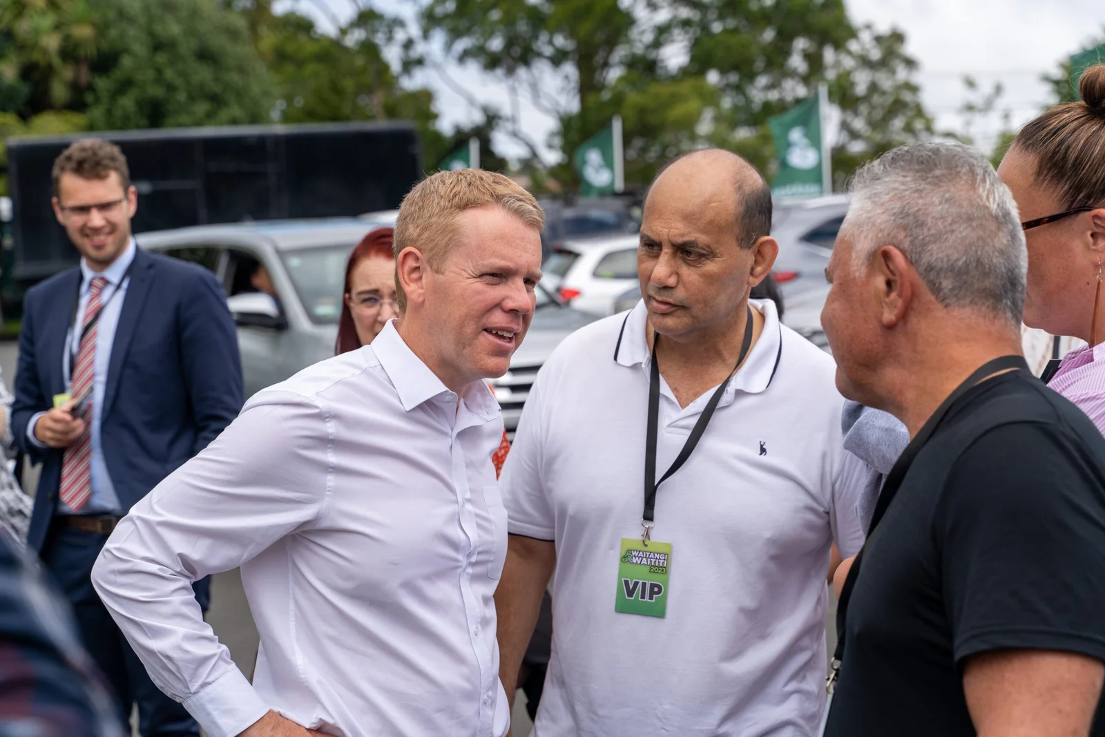 Group of men conversing at an event