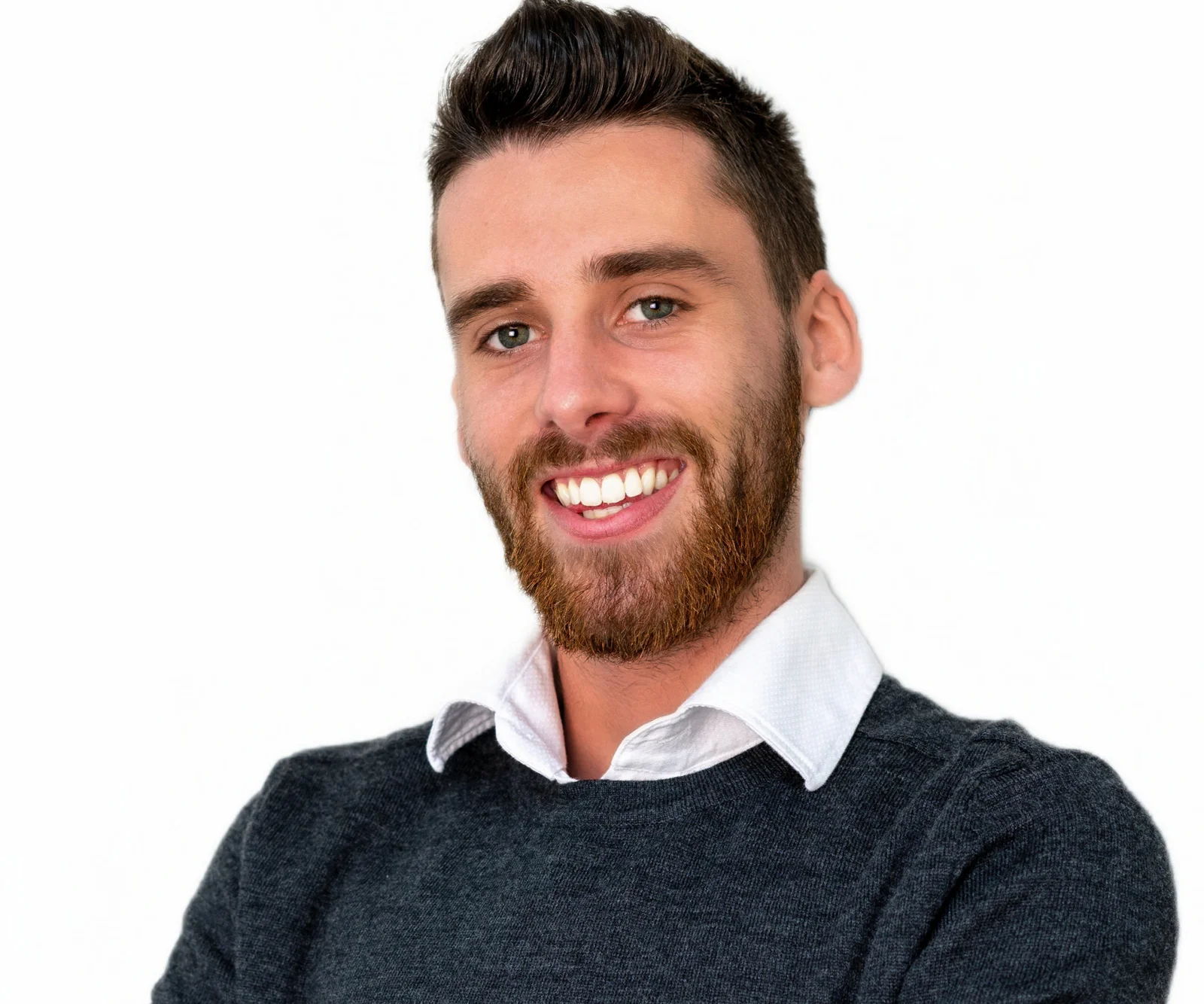 Headshot of a smiling young man with a beard