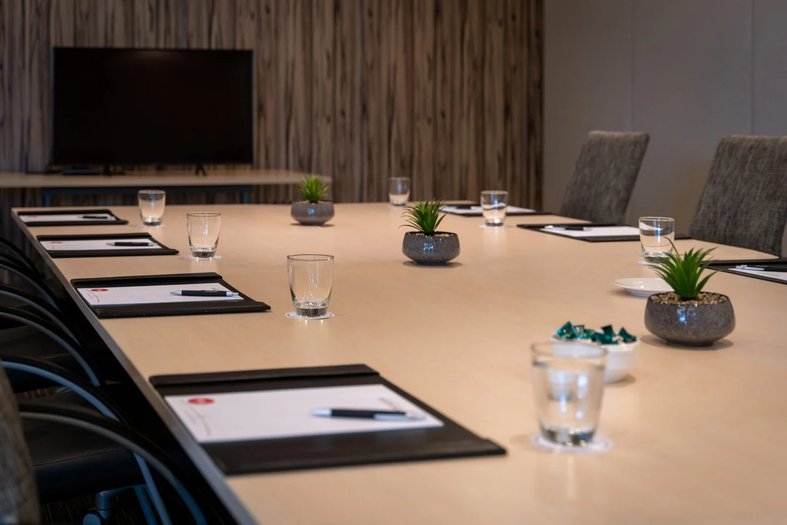 Modern conference room with a long table set for a meeting